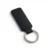 wikxy-laser-engraved-leather-keyholder-rectangular-shape-black A black, blank premium leather keyholder before customisation, showcasing the raw stitching and thick leather grain on a wooden workshop table by WIKXY.