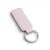 wikxy-laser-engraved-leather-keyholder-rectangular-shape-light-pink A pink colour, blank premium leather keyholder before customisation, showcasing the raw stitching and thick leather grain on a wooden workshop table by WIKXY.