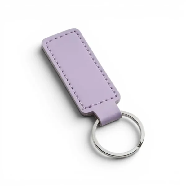 wikxy-laser-engraved-leather-keyholder-rectangular-shape-lilac A lilac colour, blank premium leather keyholder before customisation, showcasing the raw stitching and thick leather grain on a wooden workshop table by WIKXY.
