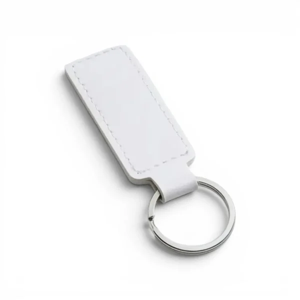 wikxy-laser-engraved-leather-keyholder-rectangular-shape-white A white, blank premium leather keyholder before customisation, showcasing the raw stitching and thick leather grain on a wooden workshop table by WIKXY.